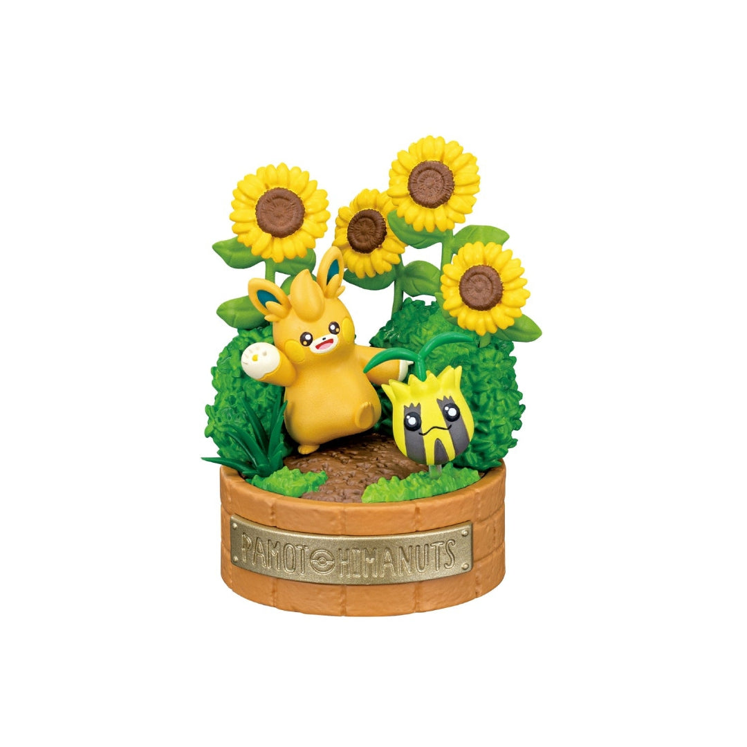 A small Pokémon figure featuring Pawmot standing with an expressive pose beside Sunkern, surrounded by tall sunflowers and green bushes. The display rests on a round, light brown base. 
